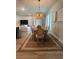 A formal dining room featuring hardwood flooring, a pendant light, and a dining room table at 6686 Treymont Dr, Lakeland, FL 33813