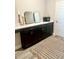 Dressing room featuring a long vanity with a dark cabinets and light countertops at 6686 Treymont Dr, Lakeland, FL 33813