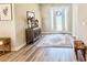 Inviting entryway features wood floors, a decorative rug, and elegant furniture for a warm welcome at 6686 Treymont Dr, Lakeland, FL 33813