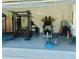 Spacious garage transformed into a home gym with a variety of exercise equipment at 6686 Treymont Dr, Lakeland, FL 33813