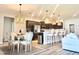 Modern kitchen with stainless steel appliances, pendant lighting, and a large island at 6686 Treymont Dr, Lakeland, FL 33813