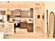 Modern kitchen with stainless steel appliances, a large island, and hardwood flooring at 6686 Treymont Dr, Lakeland, FL 33813