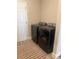 Laundry room with new, matching washer and dryer at 6686 Treymont Dr, Lakeland, FL 33813