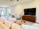 Inviting living room features a plush sofa, contemporary furniture, and bright, open layout at 6686 Treymont Dr, Lakeland, FL 33813