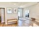 Bright living room with wood-look floors, natural light, and neutral decor for a welcoming space at 6686 Treymont Dr, Lakeland, FL 33813