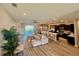Open-concept living space featuring kitchen, dining, and living areas with modern decor and finishes at 6686 Treymont Dr, Lakeland, FL 33813