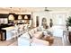 Open-concept living space featuring kitchen, dining, and living areas with modern decor and finishes at 6686 Treymont Dr, Lakeland, FL 33813