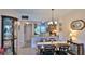Dining area adjacent to the kitchen with modern lighting and tile flooring at 717 S Beach St # 205C, Daytona Beach, FL 32114