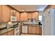 Spacious kitchen featuring modern appliances, granite countertops, and ample cabinet space at 717 S Beach St # 205C, Daytona Beach, FL 32114