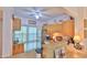 Efficient kitchen featuring wood cabinets and white appliances at 717 S Beach St # 205C, Daytona Beach, FL 32114
