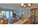 Inviting living room and dining area, with sliding doors leading to the porch at 717 S Beach St # 205C, Daytona Beach, FL 32114
