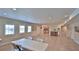 Bright and inviting meeting room with tile flooring, perfect for community gatherings with kitchen access at 717 S Beach St # 205C, Daytona Beach, FL 32114