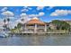 Waterfront restaurant boasts outdoor seating, fueling dock, and captivating architecture with blue skies at 717 S Beach St # 205C, Daytona Beach, FL 32114