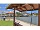 Scenic waterfront view from a swing featuring docks, boats, and waterfront buildings at 717 S Beach St # 205C, Daytona Beach, FL 32114