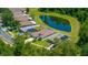 Aerial view of homes backing up to a pond and green space at 7233 Mystic Brook Way, Davenport, FL 33896