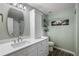 Updated bathroom with a new vanity, marble countertop, cabinet, and modern fixtures and finishes at 7233 Mystic Brook Way, Davenport, FL 33896