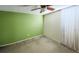 Cozy bedroom with carpet, ceiling fan, and neutral wall colors at 7233 Mystic Brook Way, Davenport, FL 33896