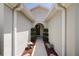 Inviting front entryway with decorative landscaping and a covered walkway leading to the front door at 7233 Mystic Brook Way, Davenport, FL 33896