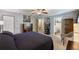 Spacious main bedroom with a ceiling fan, an ensuite bathroom, and a walk-in closet at 7233 Mystic Brook Way, Davenport, FL 33896