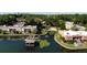 Scenic aerial view of waterfront condos, docks, and a fountain, with a community pool and downtown skyline at 758 E Michigan St # 208, Orlando, FL 32806