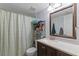 Functional bathroom features a shower, vanity, and a well-lit mirror, all in a clean and tidy setting at 758 E Michigan St # 208, Orlando, FL 32806