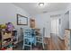 Dining room area with natural lighting, wood-look flooring, and a decorative mirror at 758 E Michigan St # 208, Orlando, FL 32806