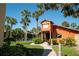View of the pool house and surrounding landscape with palm trees at 758 E Michigan St # 208, Orlando, FL 32806
