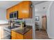 Updated kitchen with stainless steel appliances and ample counter space at 758 E Michigan St # 208, Orlando, FL 32806