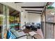 Relaxing screened patio with outdoor seating and a view of the community pool and lush landscaping at 758 E Michigan St # 208, Orlando, FL 32806