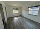 Bright bedroom featuring two windows and a closet at 7604 Forest City Rd # 11, Orlando, FL 32810