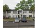 Traditional-style apartment building featuring a gated entrance and convenient parking at 7604 Forest City Rd # 11, Orlando, FL 32810