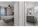 Modern bathroom featuring a vanity with sink, mirror, window, and a view of the bedroom through the doorway at 772 Driving Range Ct, Kissimmee, FL 34747