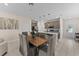 Open-concept kitchen and dining area featuring pendant lighting and modern countertops, perfect for gatherings at 772 Driving Range Ct, Kissimmee, FL 34747