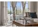 Bright living room featuring a modern coffee table, stylish sofa, and large sliding glass doors to outdoor living at 772 Driving Range Ct, Kissimmee, FL 34747