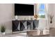 Modern living room setup with sleek media console and stylish decorative elements at 772 Driving Range Ct, Kissimmee, FL 34747