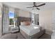 Bright, spacious bedroom with a ceiling fan, natural light, and stylish furnishings at 772 Driving Range Ct, Kissimmee, FL 34747