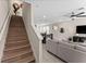 Staircase view leading into living room and dining area at 772 Driving Range Ct, Kissimmee, FL 34747