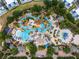 The waterpark has resort-style pools, palm trees, lounge chairs, and colorful umbrellas at 772 Driving Range Ct, Kissimmee, FL 34747
