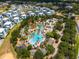 A beautiful waterpark featuring resort-style pools, palm trees, and many lounge chairs at 772 Driving Range Ct, Kissimmee, FL 34747