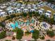 Beautiful resort-style pools, palm trees, lounge chairs, and colorful umbrellas at the waterpark at 772 Driving Range Ct, Kissimmee, FL 34747