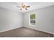Neutral bedroom with a ceiling fan, one window and neutral carpeting at 778 Del Prado Dr, Kissimmee, FL 34758