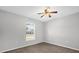 Neutral bedroom featuring neutral carpeting and one window at 778 Del Prado Dr, Kissimmee, FL 34758
