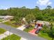 Lovely home with mature trees, a long driveway, and well-maintained landscaping at 778 Del Prado Dr, Kissimmee, FL 34758