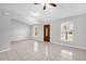 Bright living room featuring neutral paint, tile floors, and natural light from dual windows at 778 Del Prado Dr, Kissimmee, FL 34758