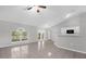 Bright living room featuring neutral paint, tile floors, and a view to the outside at 778 Del Prado Dr, Kissimmee, FL 34758