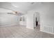 Bright living room featuring neutral paint, tile floors, and archways at 778 Del Prado Dr, Kissimmee, FL 34758