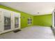 Enclosed patio with green brick walls, tiled floor, access to the backyard, and lots of space at 778 Del Prado Dr, Kissimmee, FL 34758