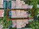 Aerial view showcases tiled roof of a luxurious home with a screened pool and meticulously landscaped yard at 8333 Via Verona, Orlando, FL 32836