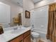 Functional bathroom with a combined tub and shower, vanity sink, and essential amenities for everyday use at 8333 Via Verona, Orlando, FL 32836