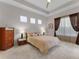 Serene bedroom featuring a comfortable bed, soft carpeting, and recessed lighting for a peaceful retreat at 8333 Via Verona, Orlando, FL 32836